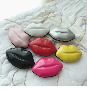Lip-shaped mini crossbody bags in glossy patent leather with gold chain straps in seven colors