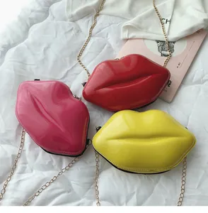 Lip-shaped crossbody bags in glossy red yellow and pink with gold metal chain straps