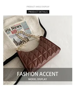 Detail of vintage brown bag featuring triangle quilting and a chunky gold chain strap