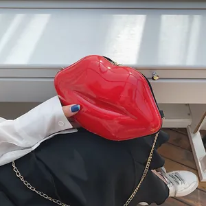 Chic red lip shaped crossbody bag with glossy patent leather and gold chain strap