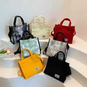 Large canvas tote bag collection in solid colors and marble patterns with shoulder straps