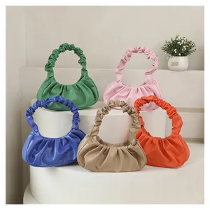 Five pleated cloud bags in vibrant colors like green, pink, blue, khaki and orange