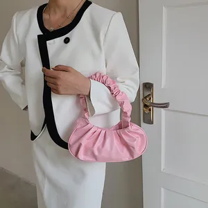 Pink pleated cloud shoulder bag with scrunched handle for women in minimalist style