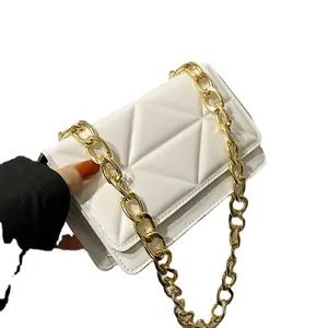 Fashionable white quilted crossbody bag with geometric design and gold chain strap