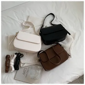 Classic faux leather saddle bags in cream, black and brown with extra shoulder straps