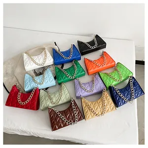 Flat lay of retro quilted PU leather crossbody bags with golden chains in 13 vibrant colors