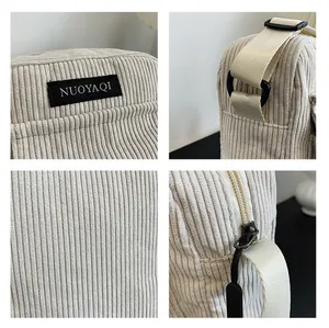 Detailed views of corduroy texture, brand label, zipper and adjustable shoulder strap