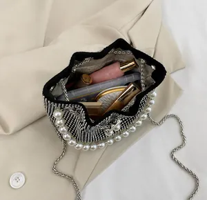 Capacity display of mini rhinestone bucket bag with pearl handle and chain strap