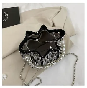 Top view of bucket bag showing inner zipper pocket, lining and pearl handle