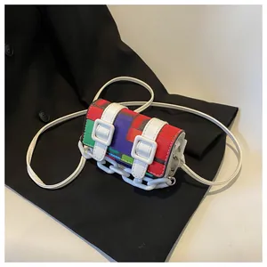 Detailed close-up of a colorful mosaic mini crossbody bag with white buckles and chain strap
