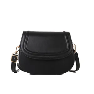 Classic black PU leather saddle bag with matte finish and gold metal hardware detailing