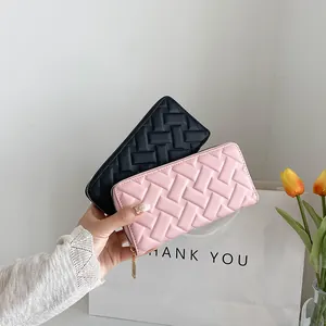 Women's long woven leather wallet in black and pink with secure gold zipper closure