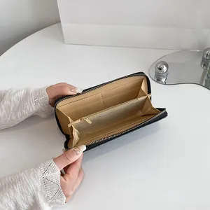 Black long faux leather wallet with zip closure and multi-card slot interior layout