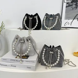 Sparkly rhinestone bucket bag with pearl handle in various colors for elegant evenings