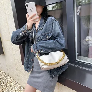 Chic white ruched cloud bag with bold gold chain strap for women, modern shoulder style