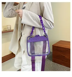 Detail of transparent purple crossbody bag with rhinestones and chunky plastic chain