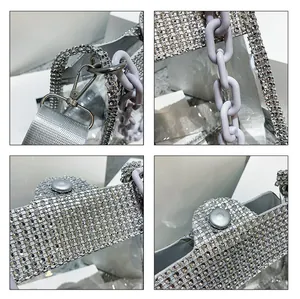Macro shot of silver rhinestones, violet chain, and polished hardware on the transparent bag
