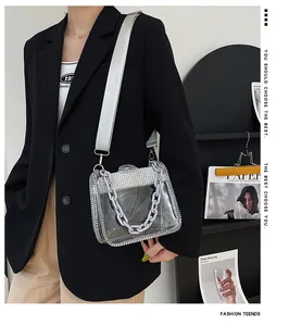 Detail of the sparkling rhinestone edges and modern thick chain decoration on the bag