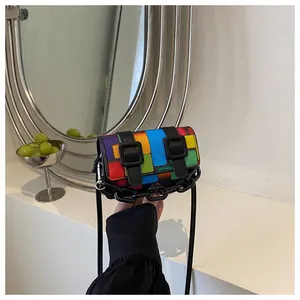Close-up of mini crossbody bag with colorful mosaic pattern and chunky black chain handle