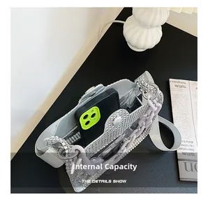 Internal capacity of silver rhinestone mini bag showing space for a smartphone
