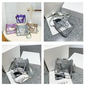 Detail view of sparkling rhinestone-edged transparent PVC mini bags in multiple colors