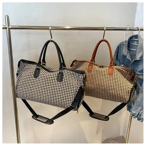 Borsa da viaggio pied de poule con manici in pelle e tracolla regolabile