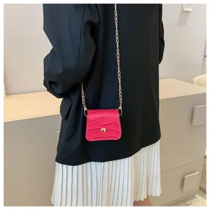 Micro croc-effect crossbody bag in bright fuchsia with delicate gold chain strap