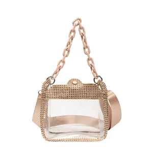 Transparent PVC crossbody bag with sparkling gold rhinestones and acrylic chain strap