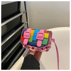 Close-up of a colorful mini crossbody bag featuring a unique mosaic color-block pattern