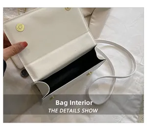 Détail de l'intérieur du sac blanc avec fermeture magnétique et doublure noire