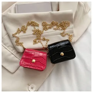 Mini croc-effect crossbody bags in black and rose red with gold chain straps