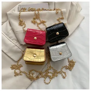 Mini faux crocodile leather crossbody bags in pink, black, gold, and silver colors