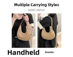 Detail showing hand-held and single shoulder styles of beige crocodile pattern handbag