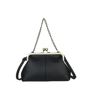 Classic black lychee pattern shell bag with vintage metal clasp and chain strap