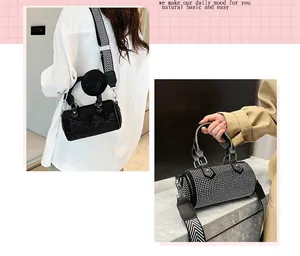 Detail of rhinestone boston bag with detachable strap and matching mini coin purse
