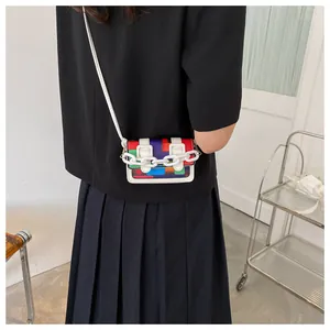 Back view of a mini colorful geometric crossbody bag with decorative white chain