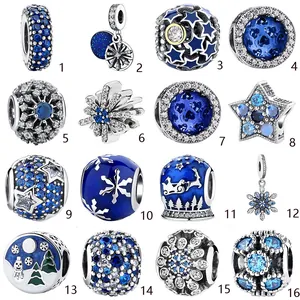 Detailed grid view of sixteen ocean and winter themed blue alloy charms and crystal beads