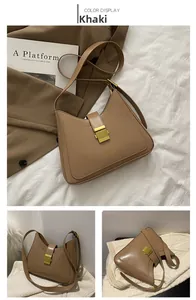 Close-up of khaki shoulder bag with gold square buckle and FASHION & BAG lettering