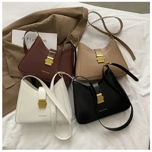 Flat lay view of four stylish bucket bags in burgundy, beige, white and black colors