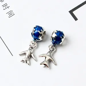 Creative airplane and globe pendant charms in silver alloy with blue enamel finish