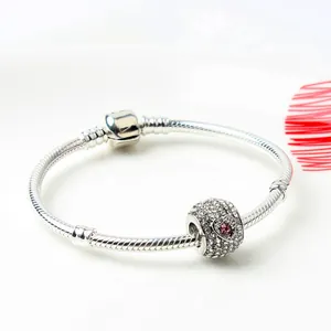 Silver snake chain bracelet with sparkling full-diamond heart bead and pink gemstone charm