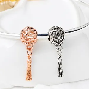 Hollow heart charm bead with metallic tassels in rose gold and antique silver finish