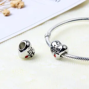 Silver heart charm with 'To Teach Is Love' engraving and red apple on snake chain