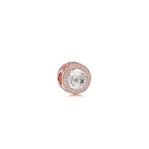 Rose gold round charm with large clear crystal and sparkling pave setting on white base