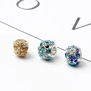 Macro detail of pavé set crystal charms in gold and silver for DIY jewelry making