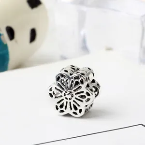 Vintage silver hollowed-out flower bead charm with intricate floral petal details