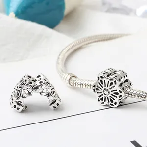 Silver hollow flower charm beads and snake chain bracelet with vintage floral design