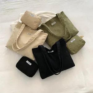 Three-piece corduroy tote bag sets in beige, green, and black with matching pouches