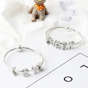 Silver alloy letter charm bracelets featuring LOVE and EVERY beaded pendants