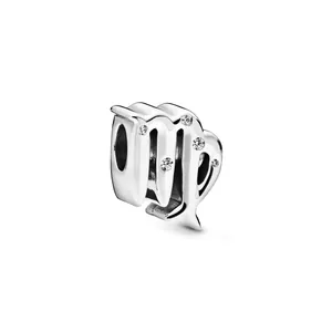 Macro detail of silver Virgo zodiac charm bead with sparkling clear crystals